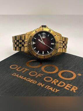 Out of Order Men’s bracelet watch with rich red gradient dial and bronze-tone